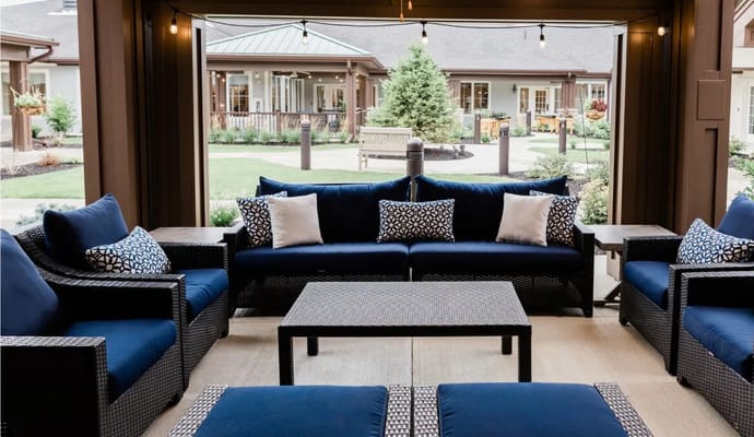 Cozy outdoor seating area with a view of the garden