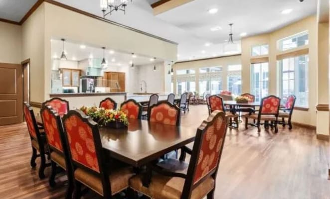 Bright dining area with wooden tables and chairs