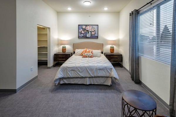 Bright and cozy interior of a resident room with bed