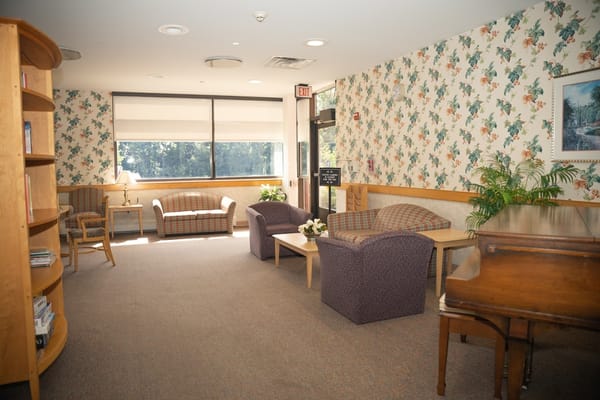 Cozy lounge area with seating and bookshelves