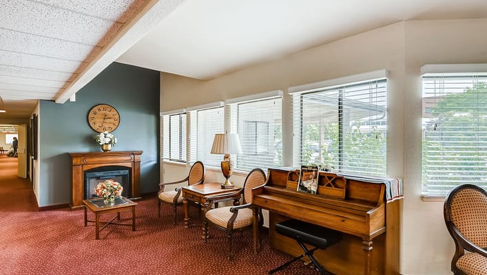 Interior lounge area with piano and seating