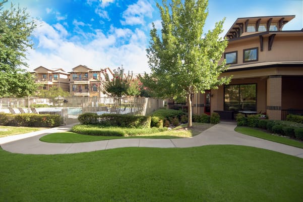 Well-maintained garden pathway leading to the facility's entrance