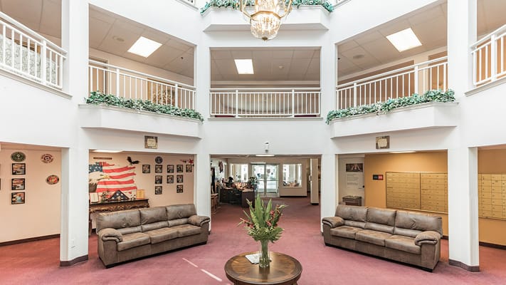 Interior view of a community common area with couches and decor