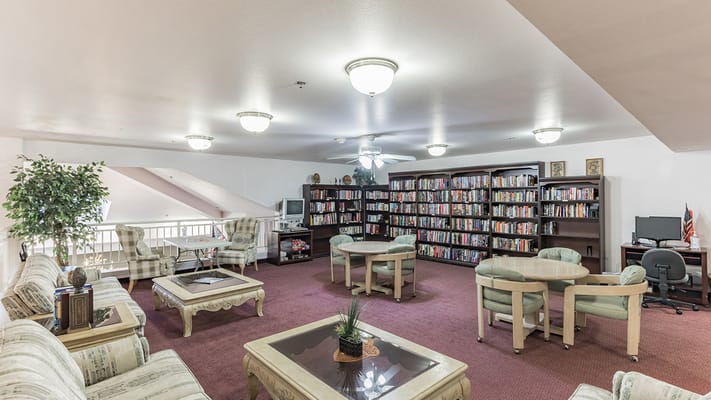 Interior view of a cozy common area with bookshelves