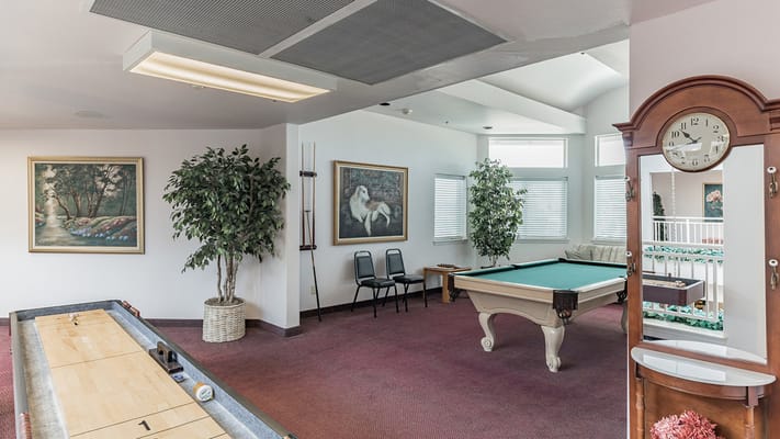 Common area with a pool table and seating