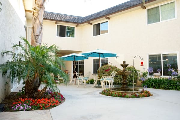 Outdoor courtyard with seating and fountain