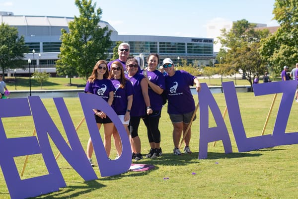 Volunteers participating in an outdoor Alzheimer's awareness event