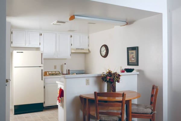Bright kitchen area with a dining table