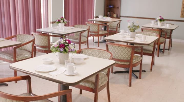Dining room set up with flowers and tableware