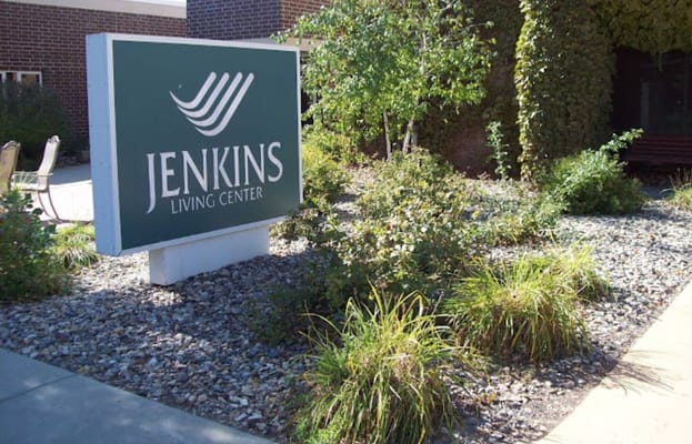 Sign of Jenkins Living Center surrounded by greenery