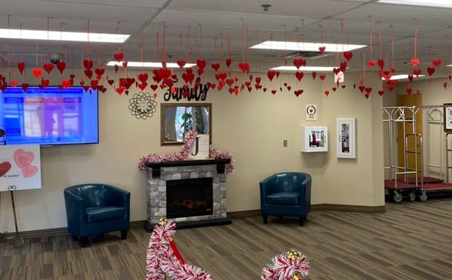Lobby with red heart decorations and comfortable seating