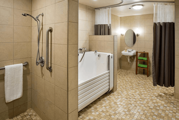 Spacious bathroom with a walk-in bathtub and safety features
