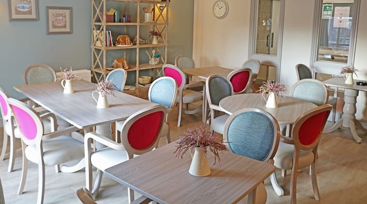 Bright dining area with elegantly arranged tables and chairs