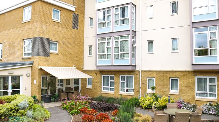 Exterior view of Lyle House Care Home with gardens