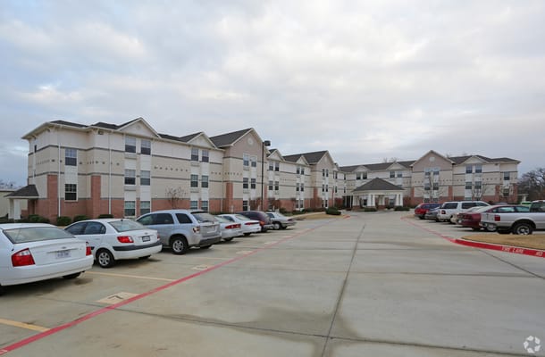 Exterior view of Magnolia Heights Retirement Community parking lot.