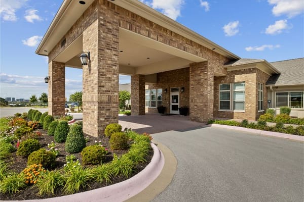Exterior entrance of Magnolia Place with landscaping