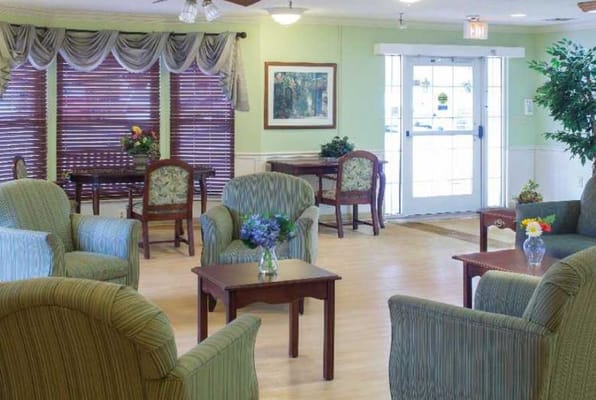 Living room area with comfortable seating and natural light.