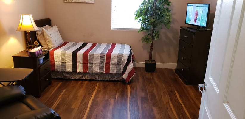 Private resident room with a bed and furnishings