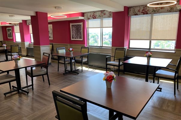Bright dining area with flowers on tables