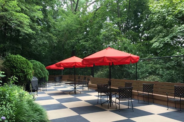 Outdoor patio area with umbrellas and seating