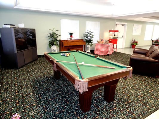 Interior view of a common area with a pool table