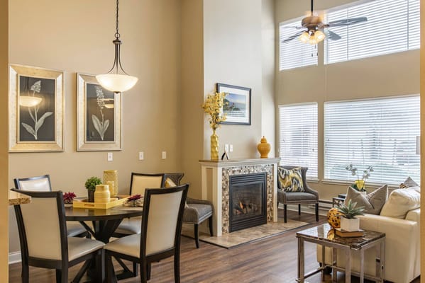 Bright common area with seating and fireplace