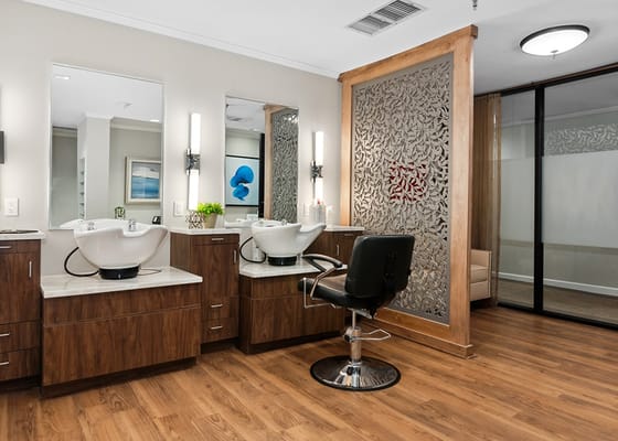 Elegant hair salon with modern styling stations and mirrors