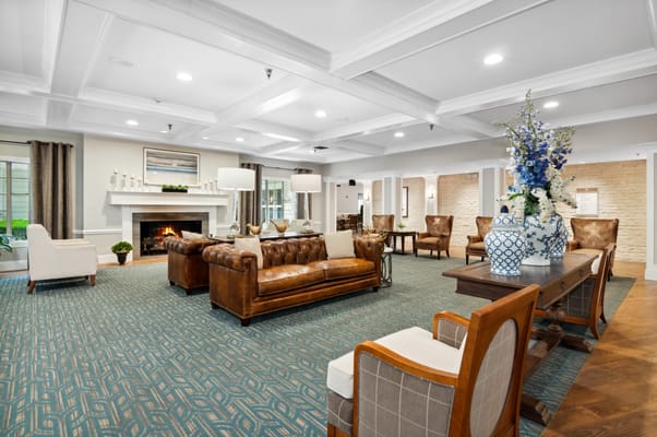 Cozy lobby with seating and fireplace at Merrywood on Park
