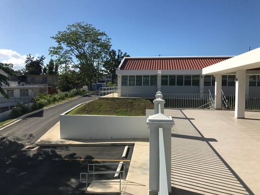 View of the exterior of Montehiedra Home Estates with garden space