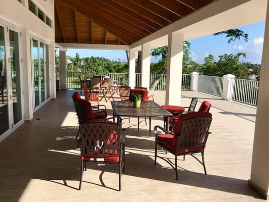 Outdoor seating area with tables and chairs