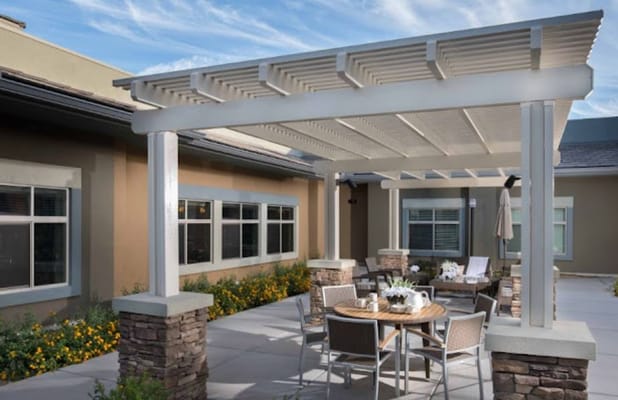 Outdoor seating area with tables and chairs