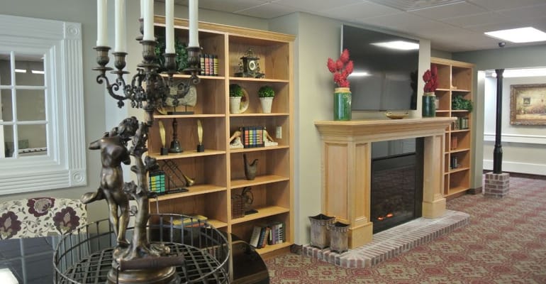 Interior view of a cozy common area with a fireplace