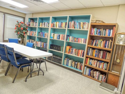 Interior view of a library with bookshelves and tables