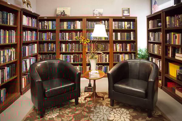 Cozy reading area with bookshelves and seating