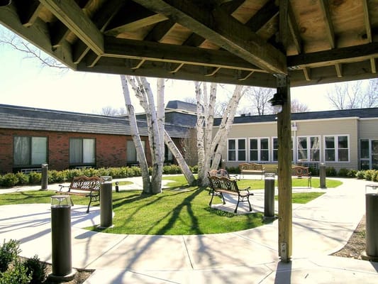 Outdoor courtyard with benches and trees