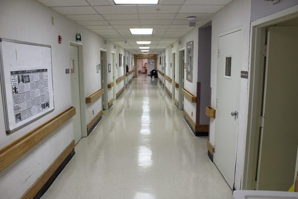 A long, well-lit hallway in a care facility