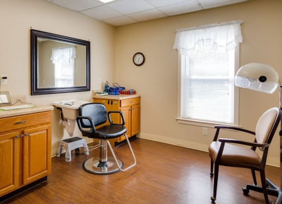 Bright interior of a treatment room with chairs and cabinets