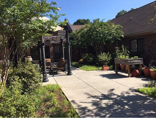 Outdoor garden area with seating and landscaping