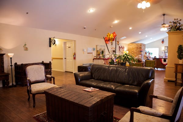 A cozy common area with comfortable seating and decorations