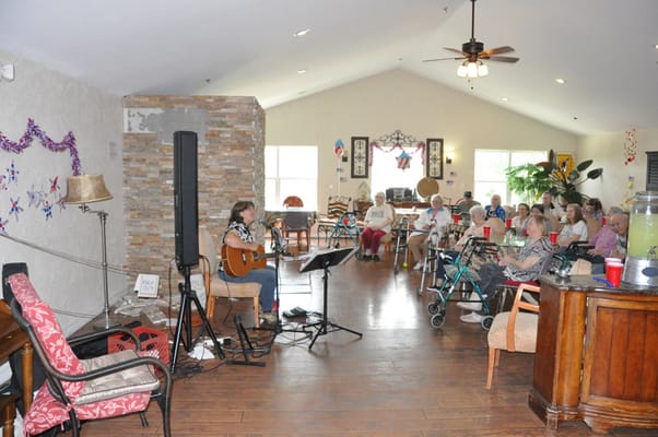 Residents enjoying live music in a common area