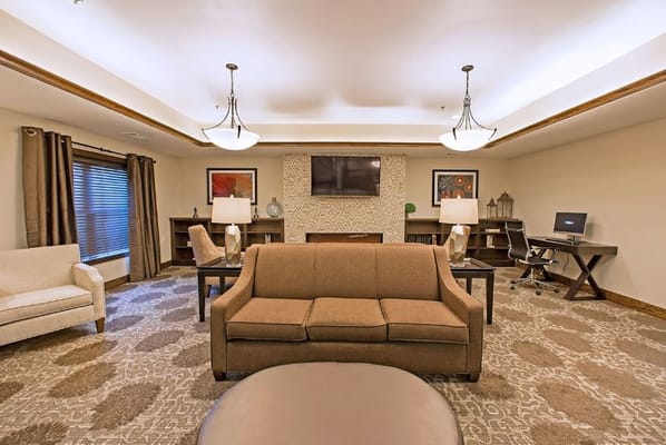 Cozy lounge area with comfortable seating and a television