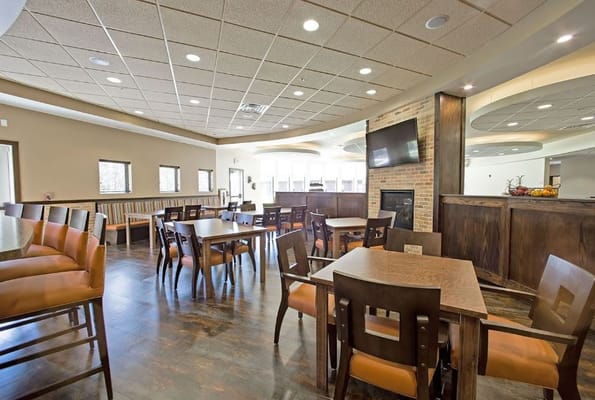Interior view of a dining room with tables and chairs