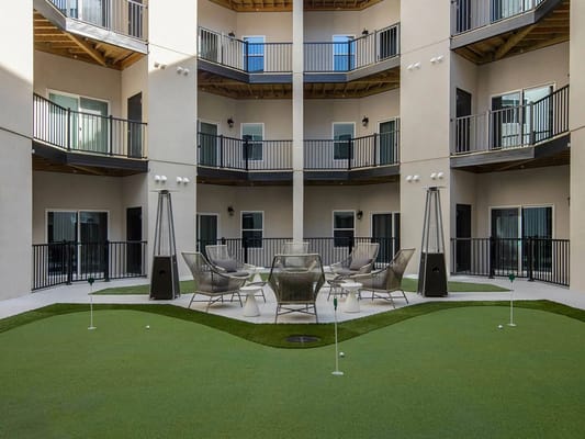 Outdoor seating area with mini-golf in a courtyard