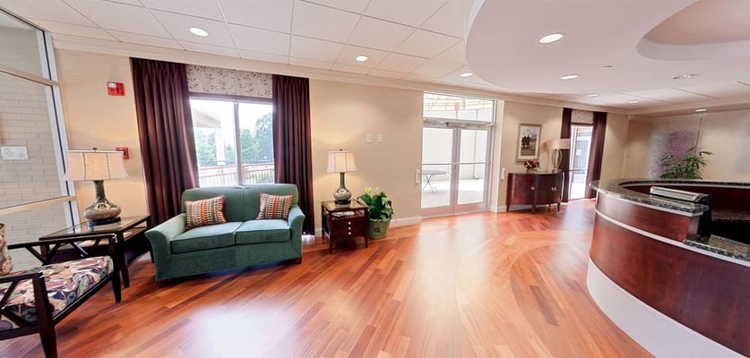 Interior lobby area with seating and natural light
