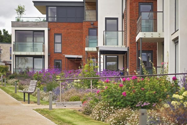 Exterior view of residential buildings with gardens