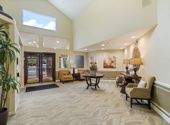 Bright and inviting lobby with seating and floral decor