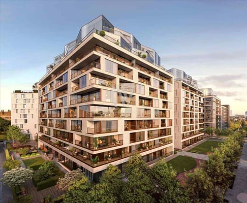Modern residential building with balconies and landscaped gardens.