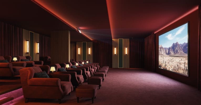 Cozy cinema room with plush seating and a large screen