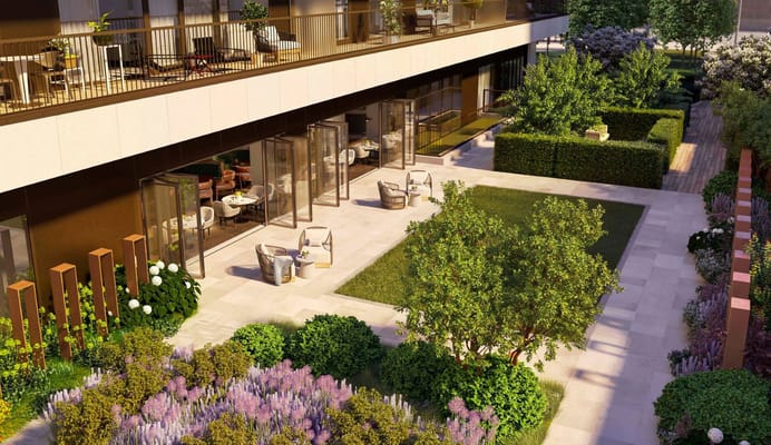 Outdoor patio area with garden and seating at Riverstone Kensington