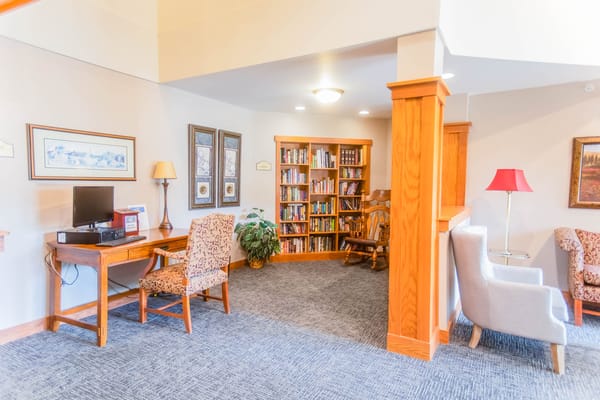 Cozy reading area with bookshelves and seating